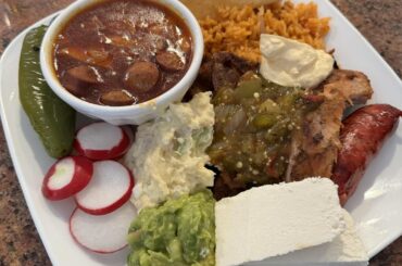 The Mexican feast we made! Well, my brother grilled the pollo asado and carne asada. I made the arroz, frijoles charros, salsa molcajete, guacamole, and pico de gallo.