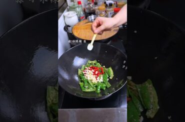 Fry the eggplant in oil and then fry it with chili for a better taste