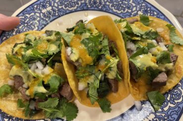 What do you do with leftover steaks? - Ribeye tacos with grilled poblano and sweet onions, white onion, cilantro and 2 hot sauces.