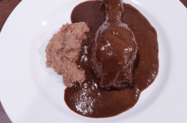 Mole rojo and refried beans.