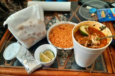 A quart of caldo de pollo with rice, bag of chips, and warm tortillas for 10 bucks at my local spot