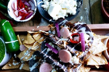 Cochinita Pibil cooked in banana leaves and homemade blue corn tortillas