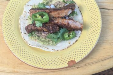 Guajillo Beef Tacos with homemade guacamole and refried beans.