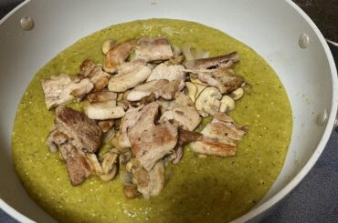 Cooked green salsa (Serrano) with fried pork belly and mushrooms.