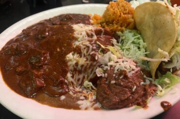 Chile Colorado plate with enchilada and chile relleno  and crispy taco