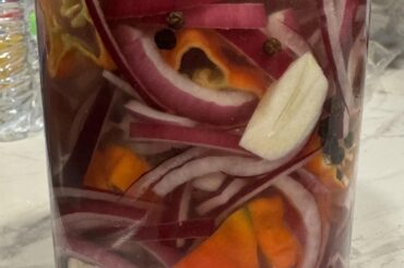 Ghost pepper pickled red onions with garlic, peppercorns, kosher salt, & a touch of sugar