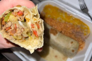 2 burritos with shredded beef, peppers and onions, and on the side, rice and the beans were covered with cheese. Big meaty burritos with no fillers, just beef, peppers and onions. Under $10 bucks.