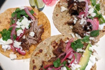 Carnitas tacos with pickled onion