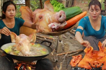 Roasted pig head with chili sauce and pig head soup tasty delicious for lunch in forest