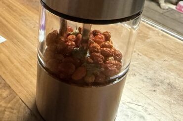 A powered grinder with Central Texas dried fave