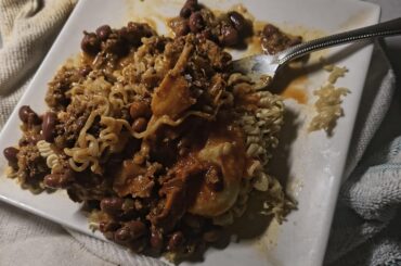 Pork tamale with ramen and chili.