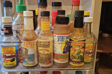Hot sauce shelf in our fridge
