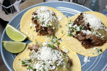 Homemade carnitas and salsa verde; served on tacos with cotija, cilantro, and onion.