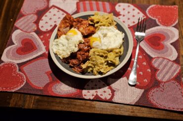 Red and green chilaquiles with fried eggs