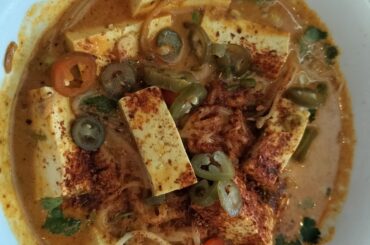 Spice level 10 yellow curry noodles with extra chili flakes and pickled jalapenos