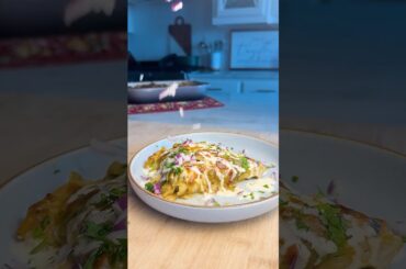 Pueblo green chili smothered chicken and steak enchiladas