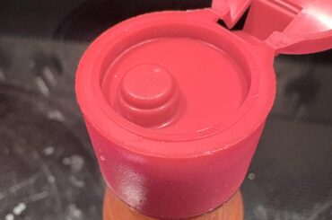 How do I open this kind of lid? I’ve had this hot sauce for two days and I want to try it. Lid does not unscrew.