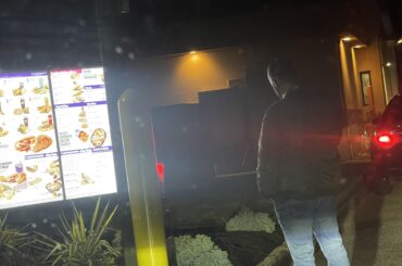 There’s a guy waiting in line without a car waiting to order from a Taco Bell