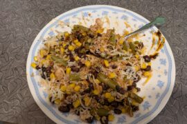Healthy lunch, rice and beans and green beans and corn and tuna and cheese mixed with fly by Jing chili oil.