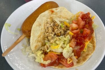 Lunch: A chicken taco, a corn dog, and flan.