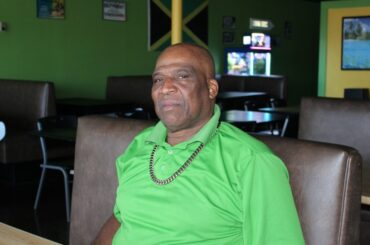 Tony Scott created the combination plate on the menu so customers didn’t have to choose between their favorite meats. For first time customers, he recommends people try the jerk chicken and oxtail ($25). (Katlynn Fox/Community Impact)