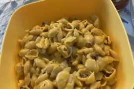 Velveeta Mac and Cheese with bacon bits and hot sauce