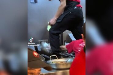 West Milwaukee Panda Express employee stands on fryer while cleaning