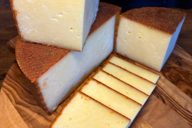 A homemade Hispanico inspired cheese. This has a cayenne pepper, chili powder and smoked paprika rubbed rind.