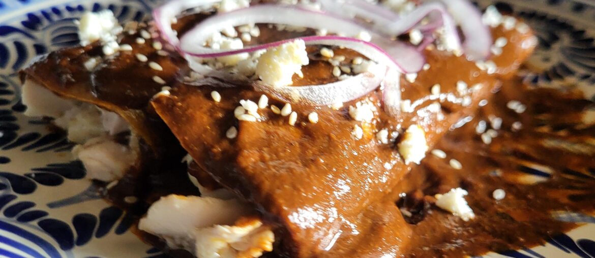 She loves my enmoladas just a bit more than my enchiladas. Mole recipe by Yuri de Gortari Krauss.