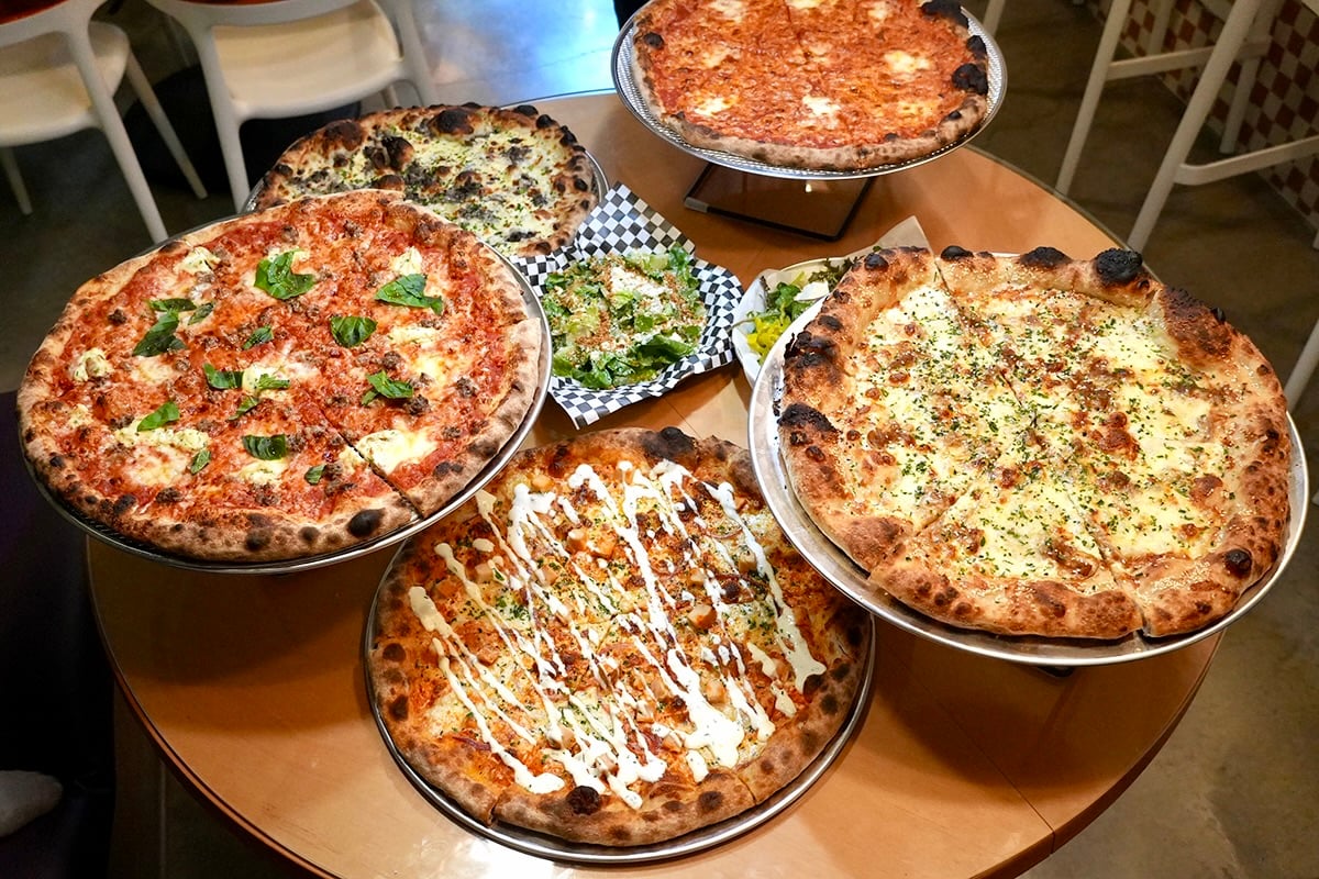assorted whole pizza pies