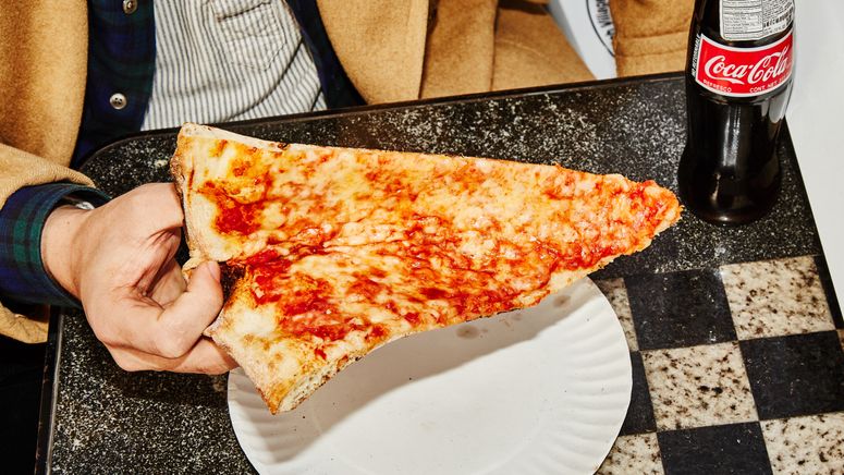Image may contain: Food, Pizza, Human, and Person
