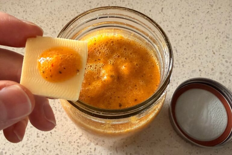 Homegrown chilis into hot sauce