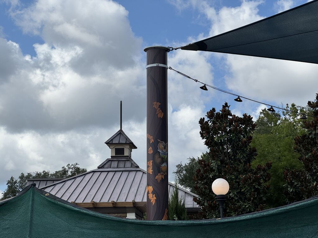 Fall-themed pictures added to white pillars in EPCOT playground 