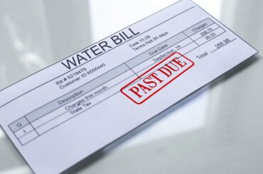 A water bill marked as "PAST DUE" with charges and due date details.