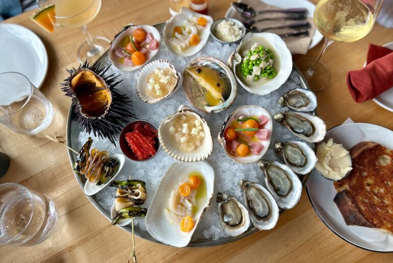 A top-down image of the sea platter from chef Jacob Harth's summer residency menu at Local Ocean, including oysters, clams, abalone and more.