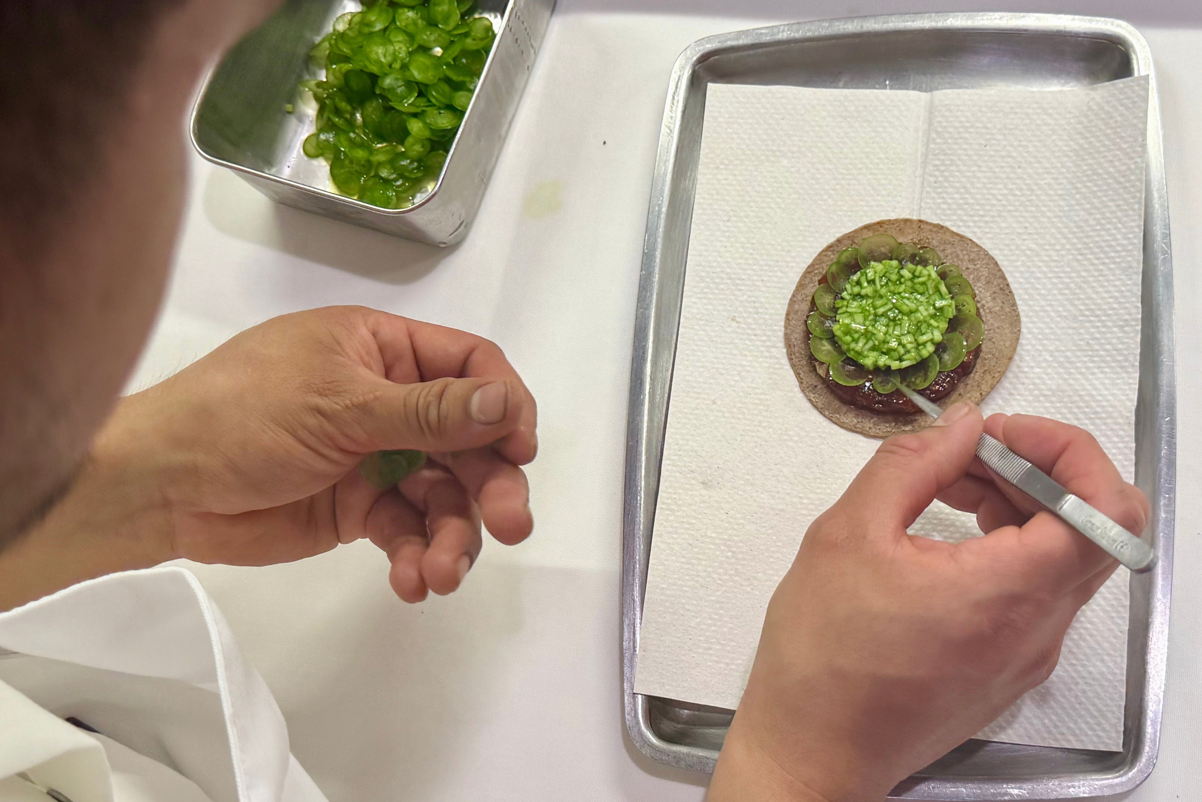 A tostada with bluefin tuna is prepared at Californios in San Francisco