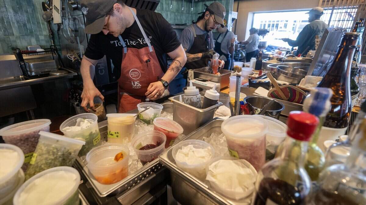 Sam Edelson, center, Anjin's chef de cuisine, and the staff prepare for evening service on Monday, March 16, 2026, at the Kansas City restaurant, a 2026 James Beard Foundation “Best New Restaurant” semifinalist.