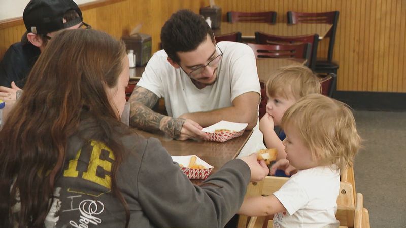Customers enjoying a meal at the reopened Original New York System on Smith Street in Providence. (WJAR)