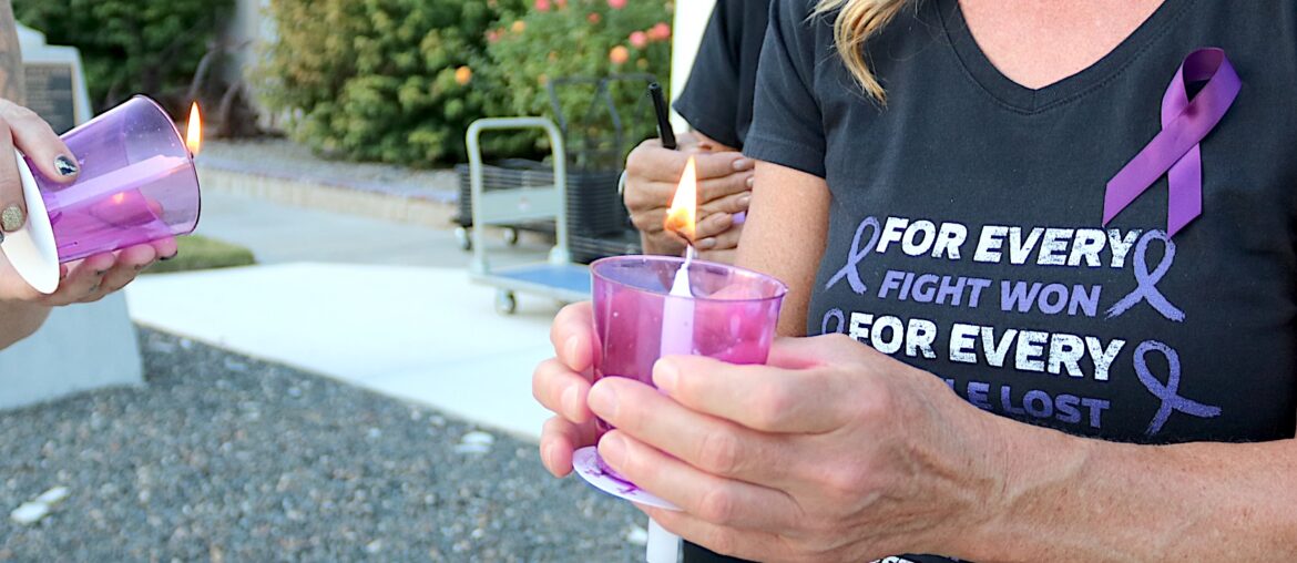 Candles illuminate domestic violence issues