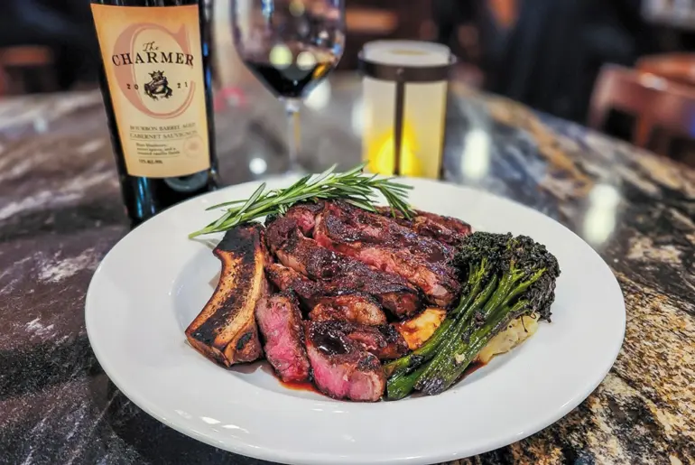 Cork and Bull steak dish and wine