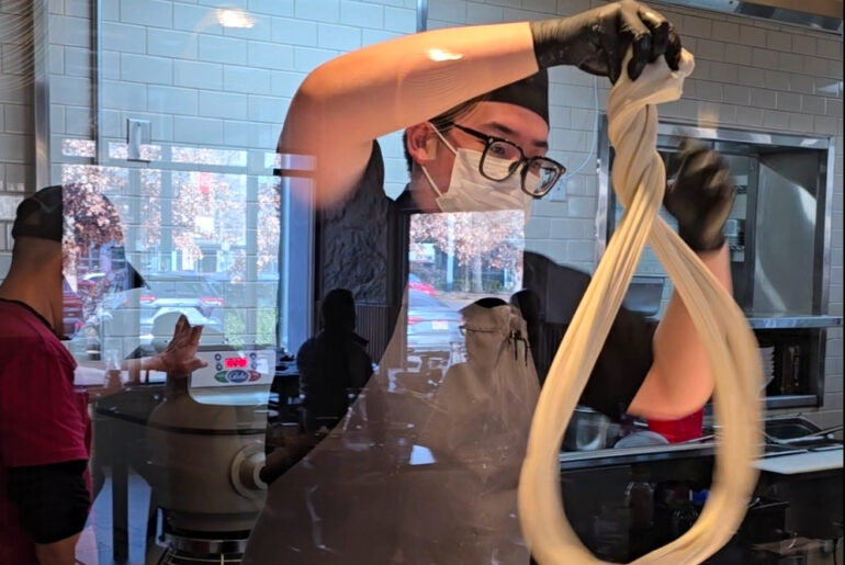 man making hand pulled noodles