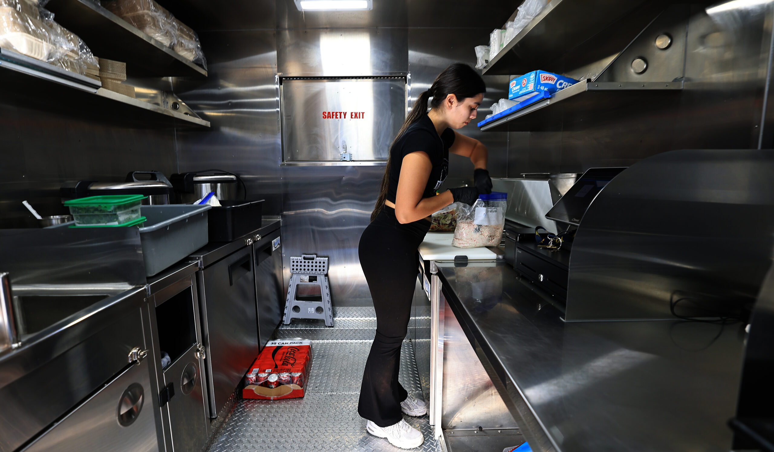 Sydnee Petri prepares for the day as she mixes ingredients for Hawaiian Style Poke, Saturday, October 10, 2026, in Santa Rosa. (Kent Porter / The Press Democrat)