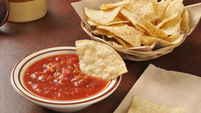 Corn chips and salsa on a table